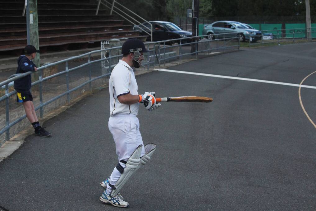 Focused: James Armstrong walks out to bat for Hibo Gold in the second innings of Saturday's match at Seiffert Oval. Photo: Zac Lowe. 