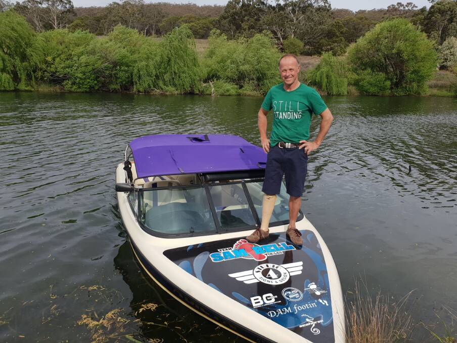 On board: Sam Bell stands on his boat, afloat on the Wollondilly River where he trains at least once a week. Photo: Zac Lowe.