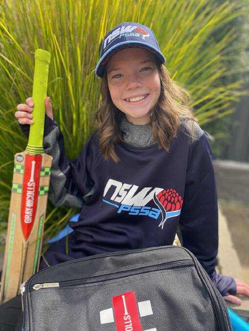 All smiles: Imogen proudly poses with her PSSA cricket gear after she was selected in the South Coast side. Photo: Supplied. 