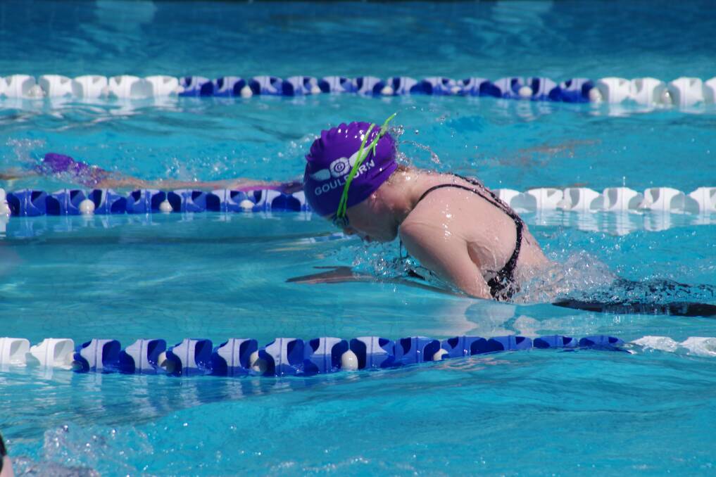 Mid-stroke: Holly Doggett performed well in the 100 metre breaststroke event at the Goulburn Aquatic Centre on Sunday, during the Goulburn Swimming Club's development meet. Photo: Darryl Fernance. 