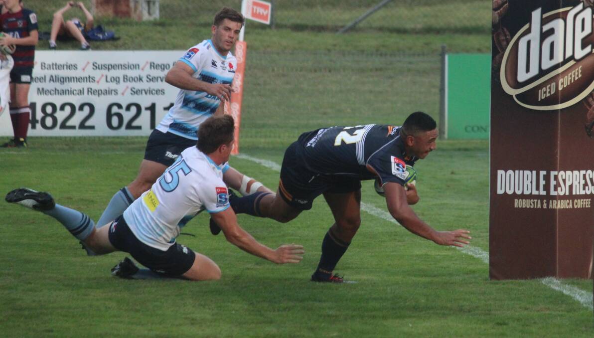 Across the line: Brumbies inside centre Irae Simone dives across the tryline in the course of their 34-28 victory over the NSW Waratahs on Thursday night at the Goulburn Workers Arena. Photo: Zac Lowe.