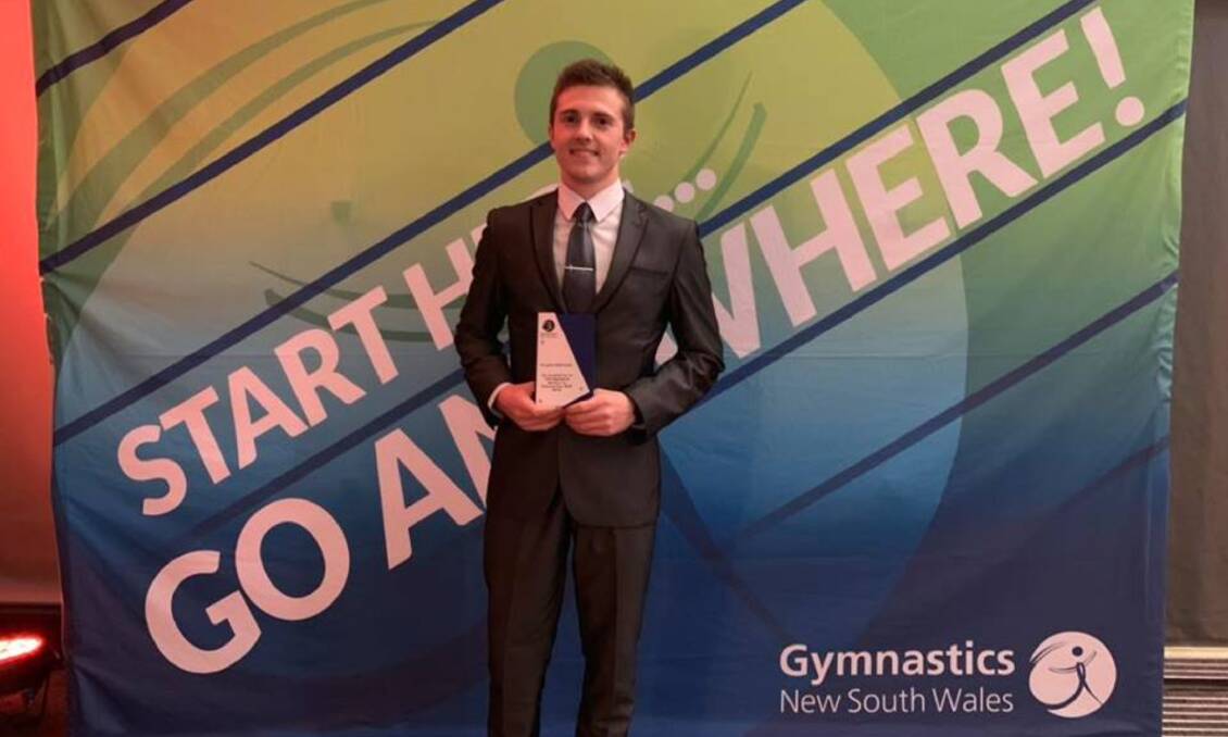 Trophy in hand: Vaughn Edmonds at the Gymnastics NSW Annual Awards night on February 9, where he accepted the Distinguished Service Award for his service to gymnastics in NSW. Photo: Invert Gymnastics. 
