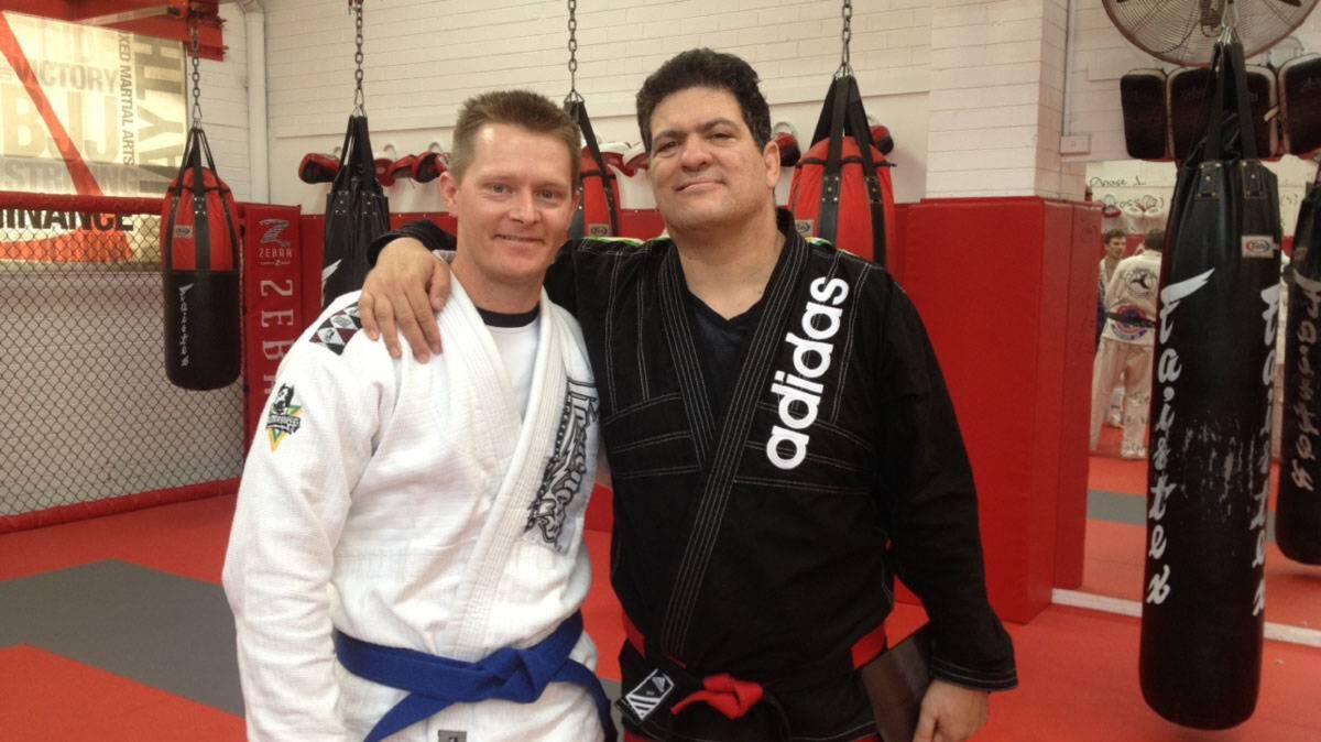 Grading time: Harmer (left) with BJJ legend Rigan Machado in 2013. Harmer has progressed past the blue belt seen here, on to purple belt, and will grade for brown later this month. Photo: Goulburn Post. 