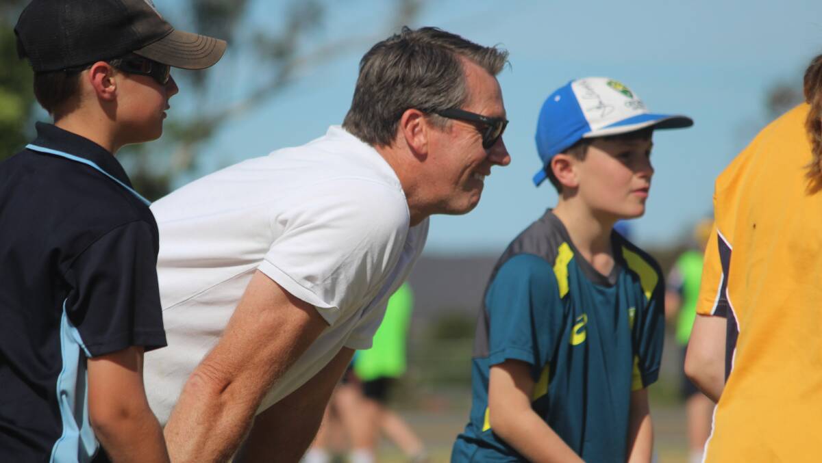 Attentive: Glenn McGrath took part in the fielding station at Seiffert Oval on Thursday afternoon, where he had great fun and gave instructions to the kids. Photo: Zac Lowe.
