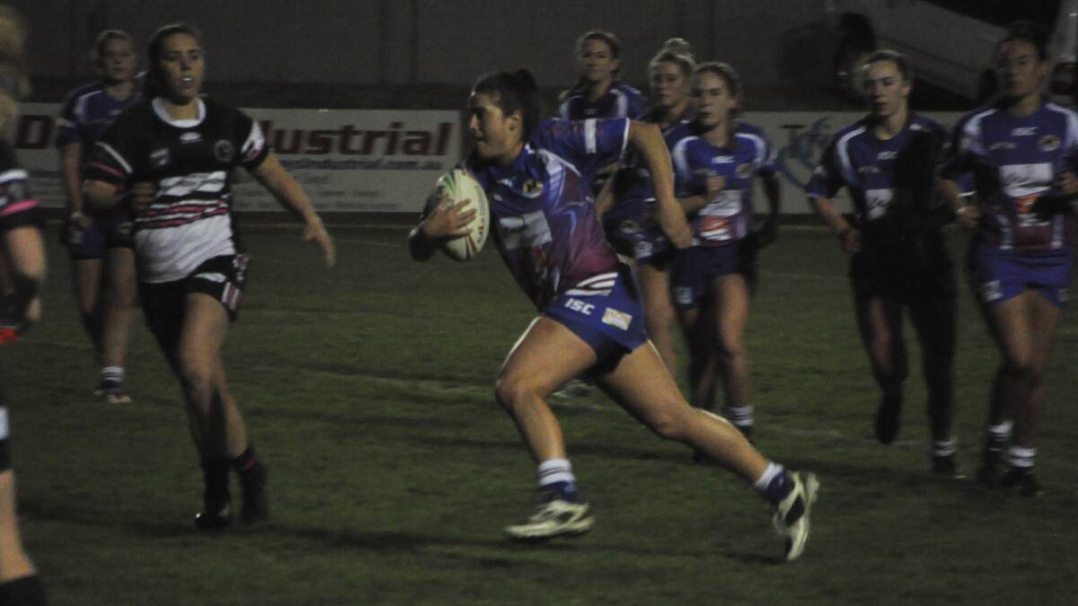 Run hard: Sassie Economos on the run during Goulburn's 10-10 draw with the Yass Magpies on Friday night. Photo: Zac Lowe. 