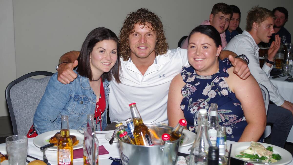 Honey Badger: Nick Cummins poses with Hayley (left) and Amy Collins at the Goulburn Workers Club. Photo: Darryl Fernance. 