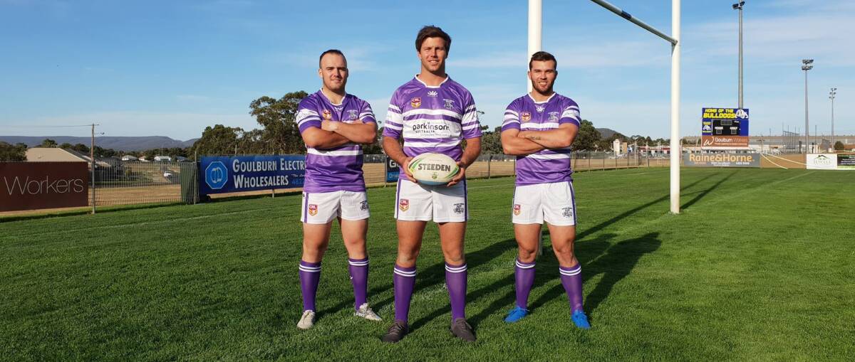Dressed up: Tyson Greenwood, Matt Worboys and Mitch Cornish show off the new jerseys that the Bulldogs will wear this weekend. Photo: Zac Lowe