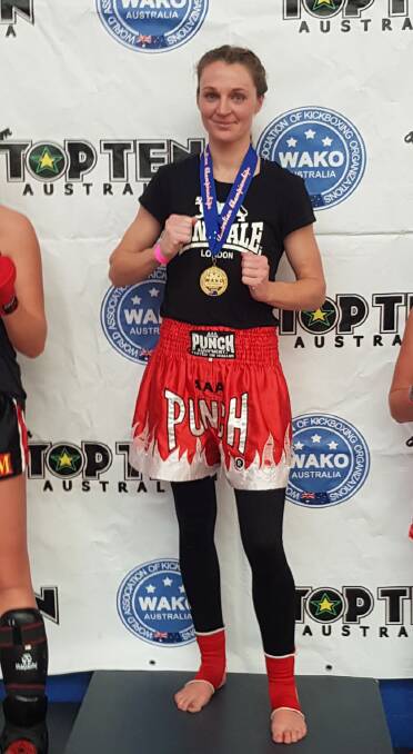 The champ: Amy Kolosque after claiming victory at the Australian National WAKO Kickboxing Championships last Sunday. Photo: Supplied. 