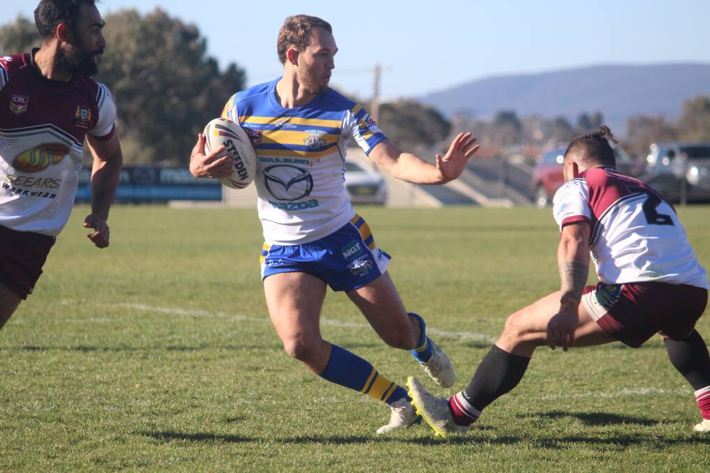 Fended: Tyler Cornish avoids a Queanbeyan tackle as he makes a beeline for the tryline on Saturday against the Queanbeyan Roos. Photo: supplied.