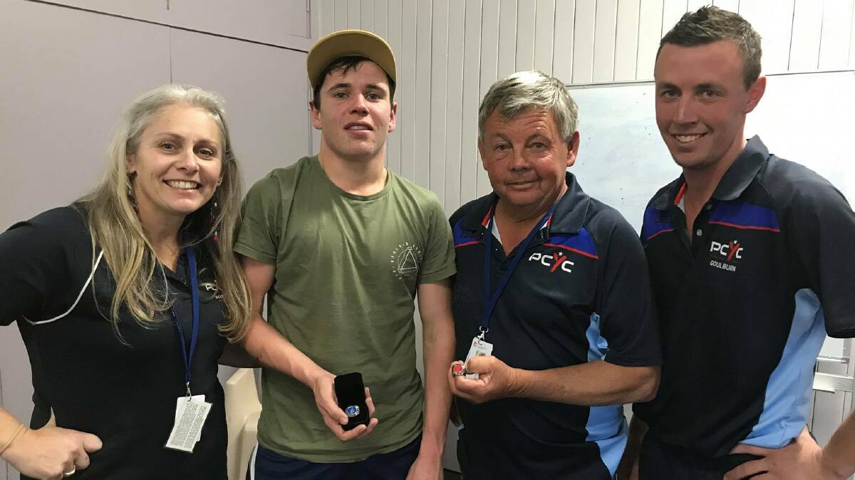 On hiatus: Glenn Oag (second from right) next to his son and fellow boxing coach Justin Oag (right), Mandy Thornthwaite, and pupil Harrison Cummins in late 2018. Photo: Goulburn PCYC.