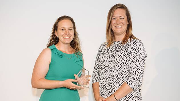 Well-earned: Claire Polosak (left) receives the Her Cricket Her Way award for her work on and off the field over the last year. Photo: Cricket NSW. 