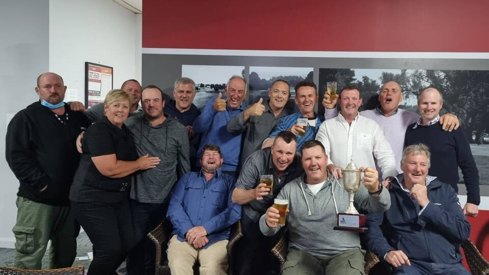 Poking fun: The Crookwell Golf Club members celebrate their Crookburn Cup 'win' after the event was actually cancelled due to poor weather. Photo: Crookwell Golf Club. 