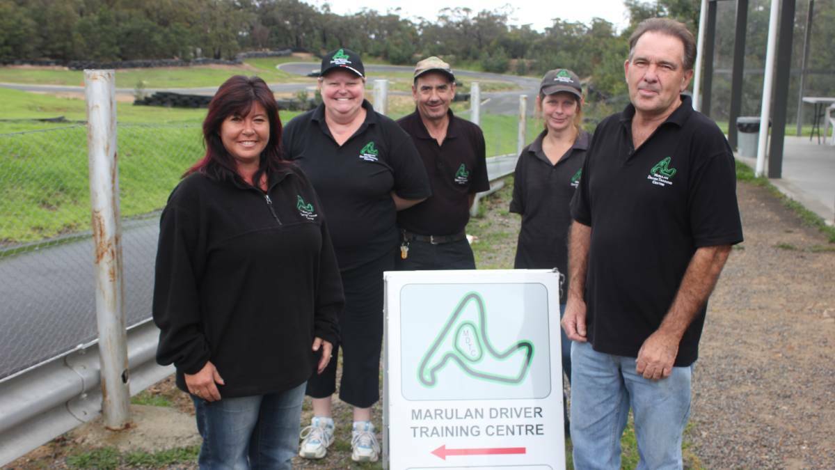 Garry Willmington (front right) with wife Natalie (front left) at the training centre.