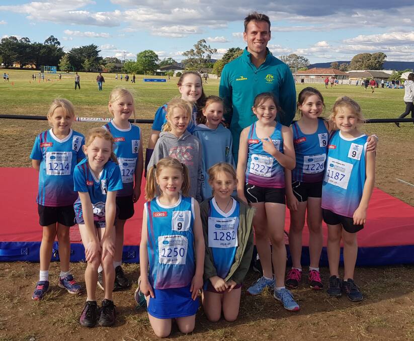 Excited: The kids were thrilled to meet a local legend last Thursday, when Kyle Cranston paid a visit to the Goulburn Mulwaree Little Athletics meet. Photo: Supplied.