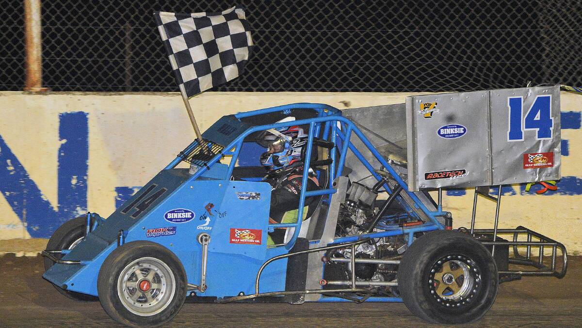 Winning flag: Trevor Perry won the GP State Title in a car which was not his, after his was damaged earlier in the night. Photo: Maximum Action Photography.
