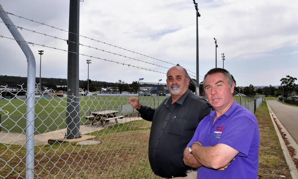 Deputy Mayor Peter Walker and Cr Andrew Banfield, pictured at the Workers Arena hockey fields, say they cannot accept the Club's lease offer and are calling on it to put forward "a reasonable offer." Photo: Louise Thrower