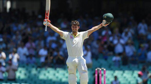 Run out averted: Mitch Marsh celebrates his hundred. Photo: AAP

