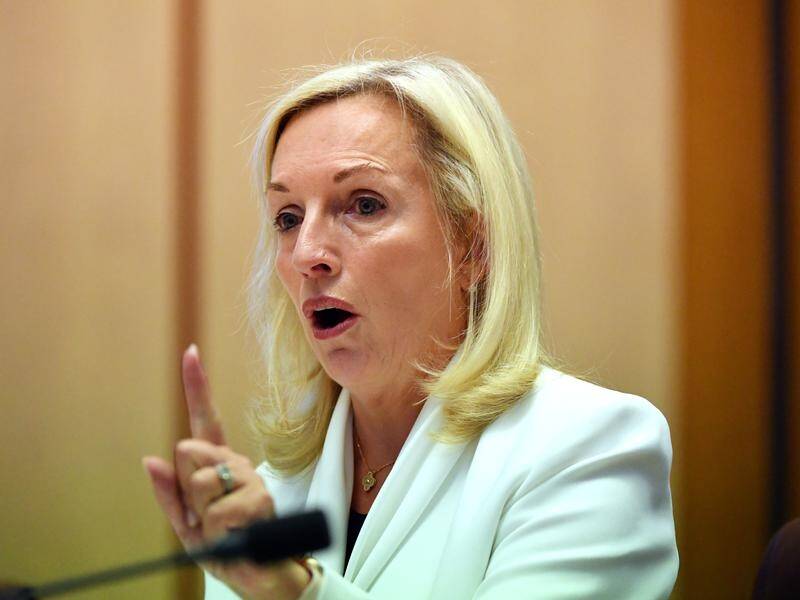 Former Australia Post boss Christine Holgate has threatened legal action against the government.