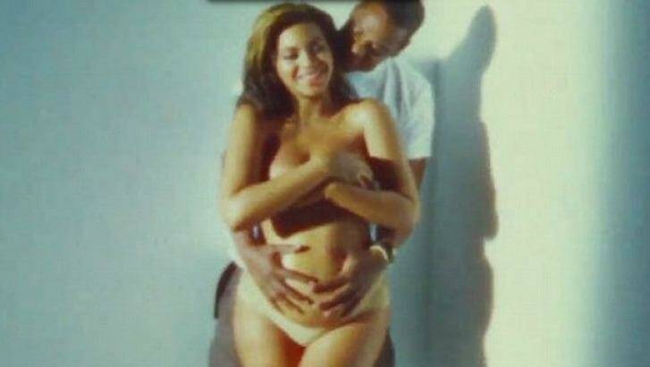 A heavily pregnant Beyonce with the couple's first child, Blue Ivy. Photo: YouTube