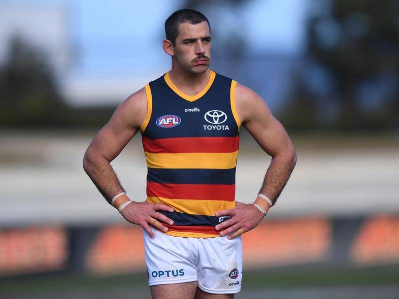Adelaide forward Taylor Walker is being investigated by the AFL over an alleged racial slur.
