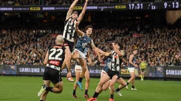 Mason Cox takes a superb mark in Collingwood's thrilling four-point win over Carlton.