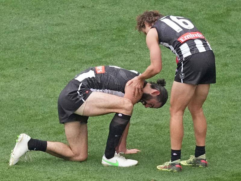 Brodie Grundy will miss Collingwood's AFL matches against the Crows and Demons with a neck injury.