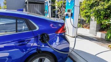 Rising living costs and high EV purchase prices are creating hurdles for buyers, a report shows. (Jono Searle/AAP PHOTOS)