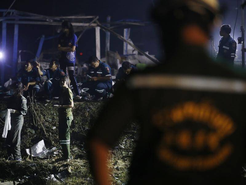 Rescue workers are on the scene after an explosion at a fireworks factory in central Thailand. (EPA PHOTO)