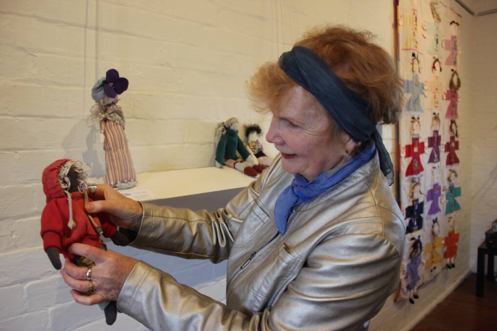 Gallery on Track's Carol Divall with a doll created by local artist Judy Echin. Photo by David Cole.
