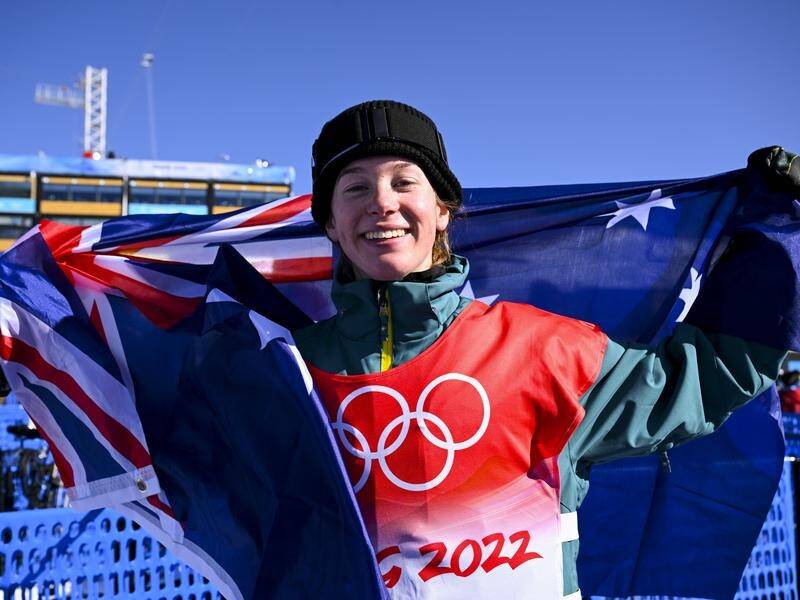 Snowboarder Tess Coady is all smiles after winning slopestyle bronze at the Beijing Olympics.