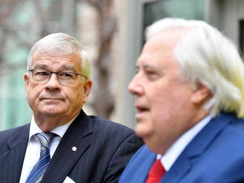 Former One Nation senator Brian Burston (L) says he is comfortable joining Clive Palmer's party.