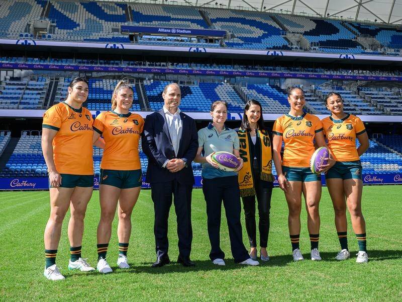Wallaroos players join Rugby Australia CEO Phil Waugh and head coach Jo Yapp at the Cadbury launch. (Bianca De Marchi/AAP PHOTOS)