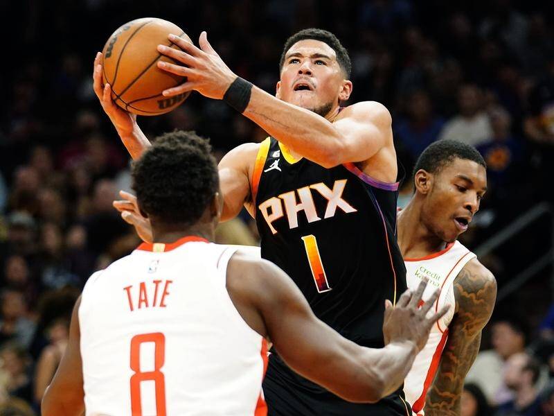 Devin Booker (c) led the Phoenix Suns' scoring in their win over the Houston Rickets. (AP PHOTO)
