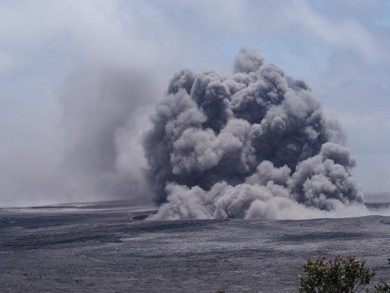 Hawaii's Kilauea volcano has belched another ash cloud as lava continues to flow into the ocean.