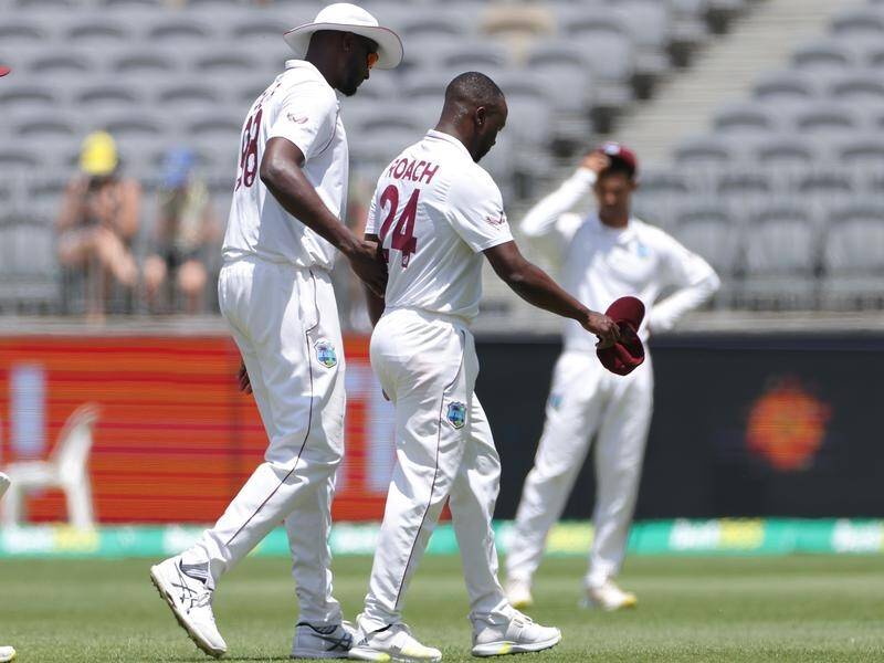 Windies fast bowler Kemar Roach leaves the field injured in the first Test in Perth. (Richard Wainwright/AAP PHOTOS)