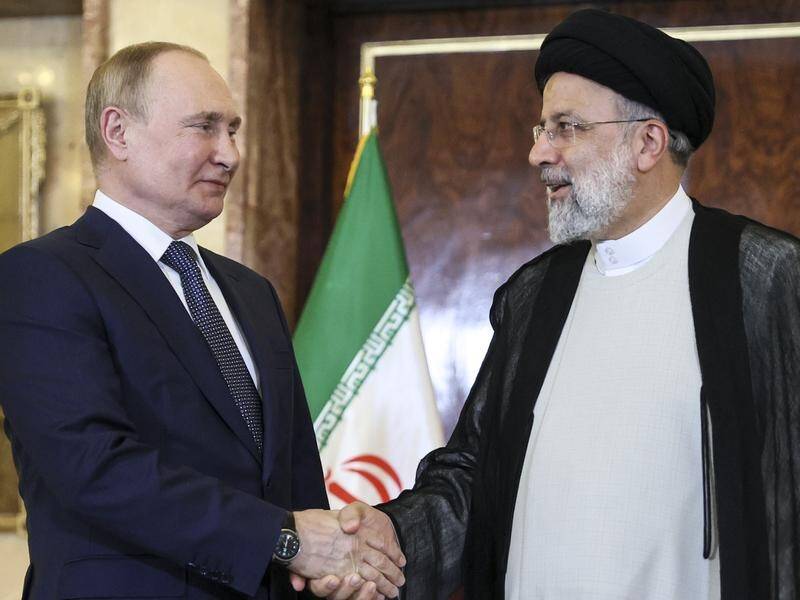 President Vladimir Putin praised his Iranian counterpart Ebrahim Raisi as a "true friend of Russia". (AP PHOTO)