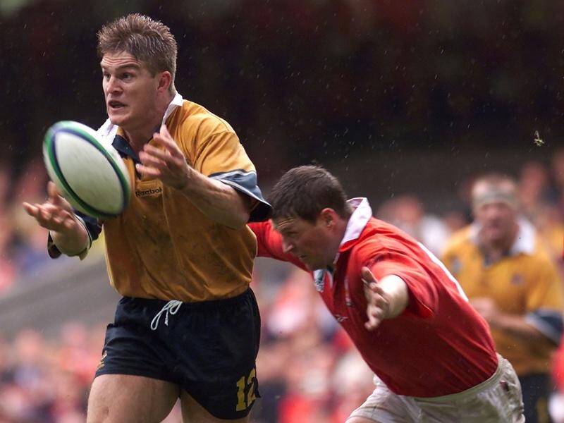 Wallaby great Tim Horan (L) has praised a fighting fund to keep young, upcoming players in rugby.