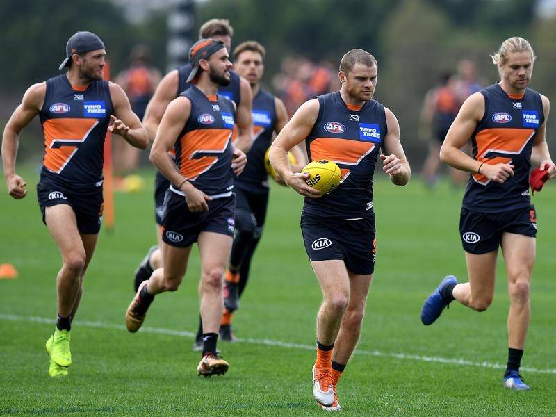 GWS player Heath Shaw (c) will play his 300th AFL match when the Giants meet Port Adelaide.