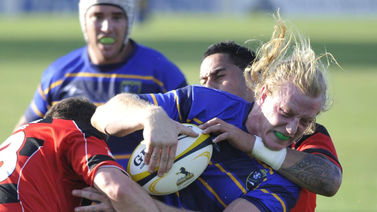 RAMPAGING BULL: Monaro captain David Akkersdyk pushes through the South Coast defence during his team’s 46-5 win at Conolly Rugby Complex on Sunday. Picture: Les Smith