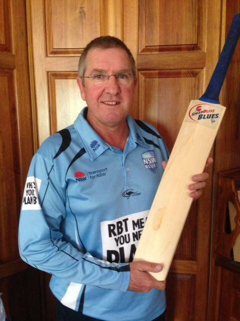 B SAFE: NSW Blues cricket coach and former Goulburn local Trevor Bayliss shows off the signed 2014/15 team bat up for grabs in the ‘Tell us your Plan B’ competition.