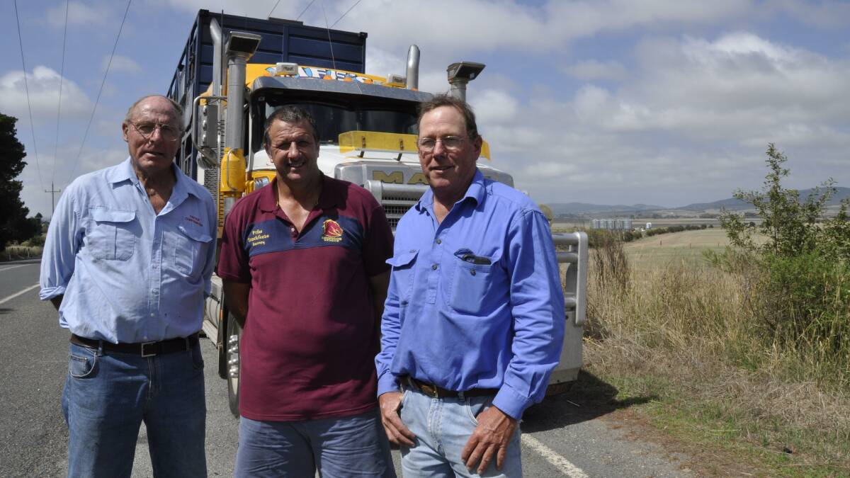 GOOD MOVE: Livestock carriers Richard Carter and Barney Collins and Tirrannaville grazier Angus Gibson (right) are applauding moves to designate
more B-double roads in Goulburn Mulwaree, including Currawang Rd in the background. 