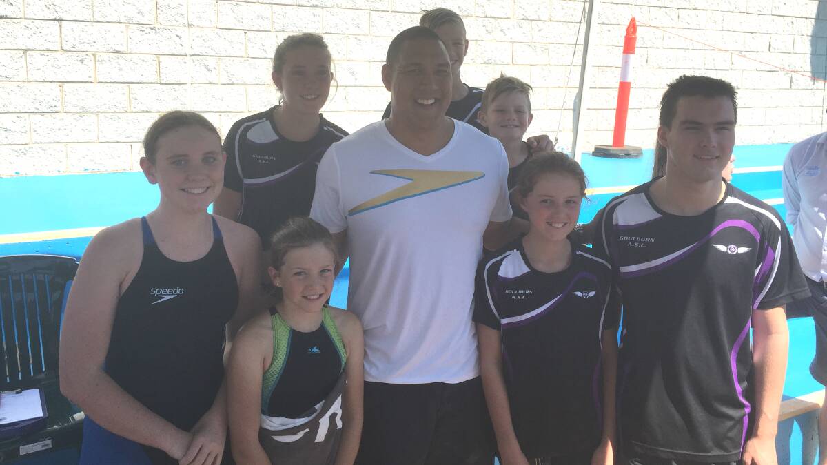 SURPRISE VISITOR: Former Olympic swimming great Geoff ‘Skippy’ Huegill paid a visit to the NSW Country Regional Meet at Wagga Wagga last weekend. He is pictured with members of the Goulburn squad: (l-r front) Marlee Harris, Ava Gilbert, Margaret Williams and Jake Cooper; (l-r rear) Jaime Craig, Lachlan Gilbert and Thorfinn Gilbert. Absent:Megan Schweers, Duke Shepherd. 