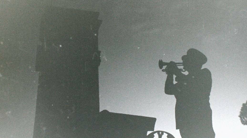 Photo of a silhouetted trumpeter at the 1978 Dawn Service from the Goulburn Post archives.