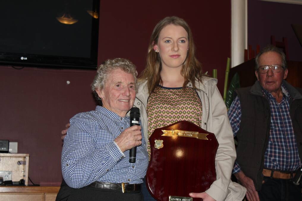 WINNER: Goulburn Rodeo Club member Emilee Battiste receives one of her awards from club stalwart Gloria Smith at the Rodeo Club’s presentation evening held at the Goulburn Workers Club on Saturday, June 13. Rodeo Club President Neil Hensley looks on.