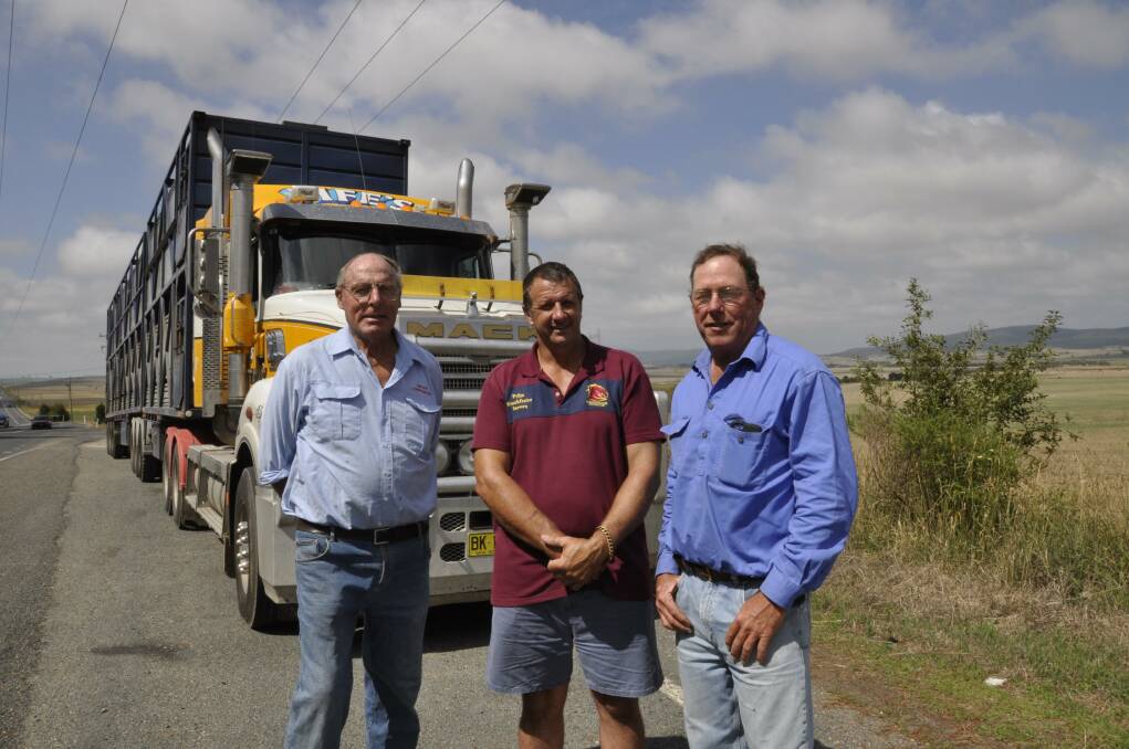 GOOD MOVE: Livestock carriers Richard Carter and Barney Collins and Tirrannaville grazier Angus Gibson (right) are applauding moves to designate more B-double roads in Goulburn Mulwaree, including Currawang Rd (in the background). (Photo: Louise Thrower). 