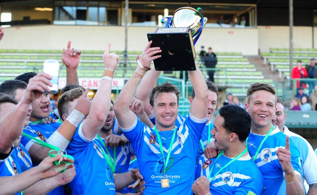 Queanbeyan Blues' captain Marc Herbert holds the Canberra Raiders Cup trophy high after his men broke a six year premiership drought, beating Goulburn 24-20 at Seiffert Oval last Sunday. Photo: Melissa Adams.