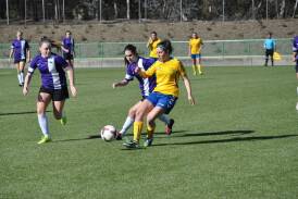 Panthers' striker Brittany Palombi makes a tackle on an ACTAS opponent last Sunday. Photo: Capital Football.