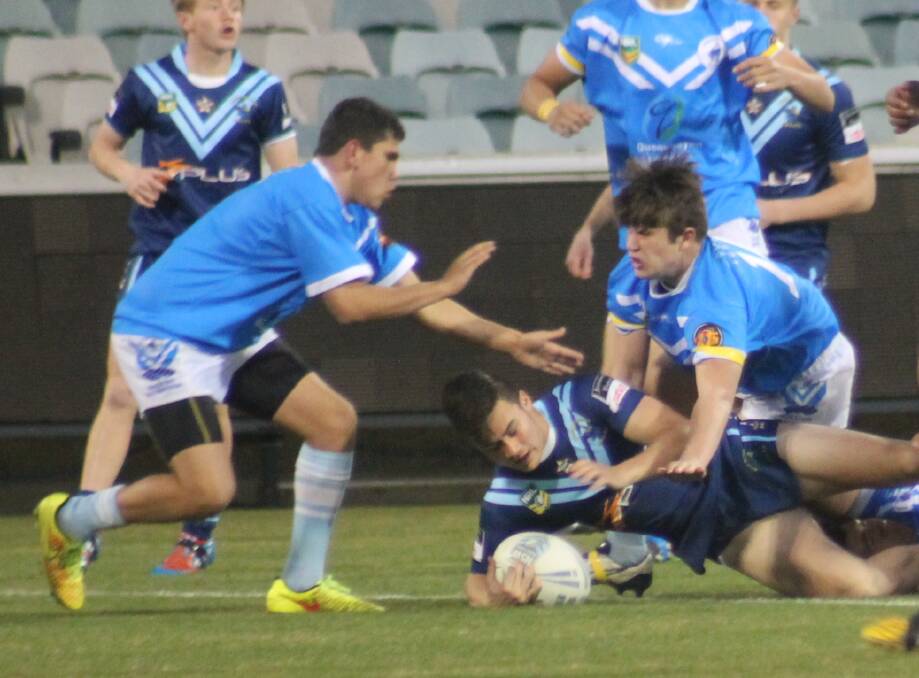 Queanbeyan Blues' players McLeod McInerney and Thomas Williams make a strong tackle last Sunday night.