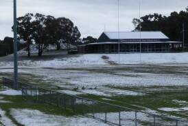 TOO WET: Goulburn Dirty Reds were lucky their games were played in Cooma because with the snow (pictured Friday morning) adding to the already slushy outfield the linesmen, ball boys, water boys, coaches and fence line spectators would have needed gumboots. Photo by Darryl Fernance. 