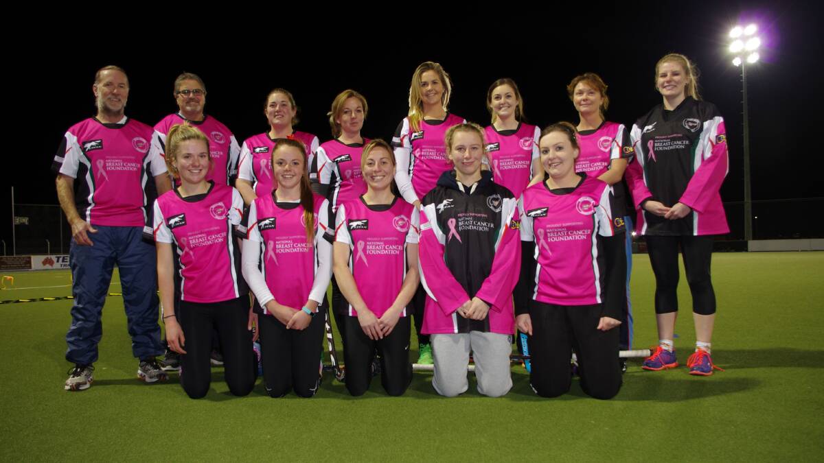 IN PINK: Goulburn’s Capital League Women’s team wearing the pink shirts that they will play in for the Chris MacKinnon Memorial Weekend on August 8-9 in Canberra and the following weekend’s home game. Back row: Coaches Andrew Woolner and Des White, Taygan Lang, Nadine Ward, Shania O’Brien, captain Marlie Gulson, Kayleigh Hadlow. Front row: Hayley Plumb, Jayde Della, Shelly Picker, Hanna Shawyer, Mel Devlin. Absent: Bianca Broadhurst, Renee George, Emily Evans, Holly Evans, Bianca Wilson, Ash McDonald, Jenna Cambridge, Rach Grant, Lacey Devlin, Chloe Montgomery Photo by Darryl Fernance. 
